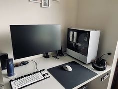 a desk with a computer, keyboard and mouse on it