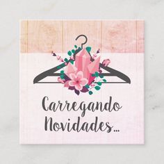 a card that says, caregando hovidadess with flowers on a hanger