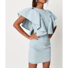 Short Extreme Ruffle Sleeve Denim Dress In A Stretchy Fabric With An Exposed Back Zip. Regular Fit Mini - Sits Mid Thigh 73% Cotton 25% Polyester 2% Elastane Fitted Mini Dress With Frayed Hem For Spring, Blue Mini Dress With Frayed Hem, Fitted Dresses With Frayed Hem For Day Out, Chic Denim Mini Dress With Ruffles, Fitted Mini Denim Dress With Ruffles, Sleeveless Blue Denim Dress With Ruffles, Blue Sleeveless Denim Dress With Ruffles, Chic Denim Dress With Frayed Hem In Mini Length, Fitted Denim Dress With Ruffle Hem