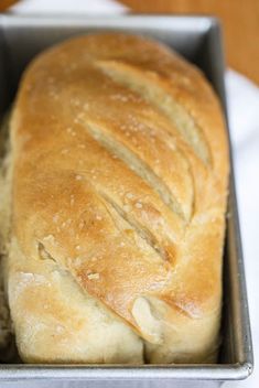 a loaf of bread in a metal pan