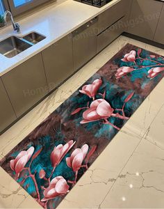 a kitchen area rug with pink flowers on it