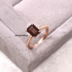 an engagement ring with a brown stone in it