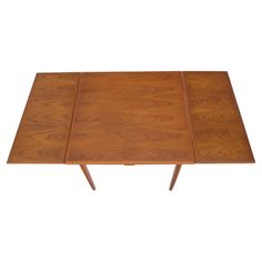 a wooden table with three sections on each side