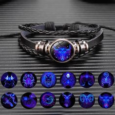 the bracelet is decorated with blue glass cabochons and features zodiac signs on it