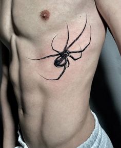 a man with a spider tattoo on his chest