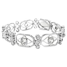 An original treasure from the Art Deco era, circa 1930. The lovely platinum bracelet features approximately 5 carats of large chunky old-cut and European-cut diamonds of their time. The diamonds are all individually bezel-set with a fine milgrain finish. Hand-fabricated in platinum, this antique treasure is ready to be worn and loved. Length: 7 inches Weight: 21.6 grams Bracelet Art, Platinum Bracelet, Gold Bracelet Chain, European Cut Diamonds, Art Deco Diamond, Art Deco Era, Metal Bracelets, Link Bracelets, Chain Bracelet