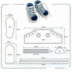 a pair of blue shoes sitting on top of a sheet of paper next to a ruler