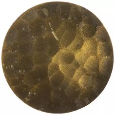 a close up of a metal disc on a white background