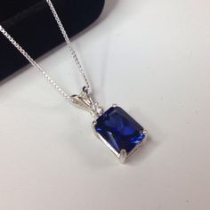 Blue Rectangular Necklace For Anniversary, Rectangular Blue Sapphire Jewelry, Formal Sapphire Necklace With Rectangular Shape, Blue Rectangular Gemstone Necklace, Blue Rectangular Diamond Cut Jewelry, Blue Rectangular Birthstone Necklace, Classic Blue Rectangular Necklace, Royal Blue Sapphire Jewelry Gift, Royal Blue Sapphire Jewelry For Gift