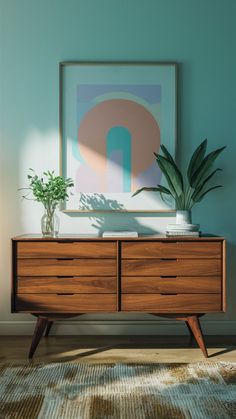 a wooden dresser sitting in front of a blue wall with a potted plant on top