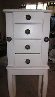 a white wooden dresser with four drawers