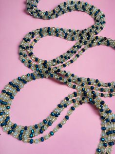 Single Strand Waist Bead - Woroba is a timeless piece inspired by the rich traditions of Ivory Coast. Meticulously handcrafted from 100% glass beads, this waist bead exudes authenticity and artistry. The deep blue color of the beads reflects the serene beauty of the Ivory Coast, adding an element of tranquility and depth to your ensemble. Each bead is a testament to the skilled craftsmanship of the artisans, showcasing the cultural richness of the region. Accentuating this single strand are silv Deep Blue Color, Ivory Coast, Spring Sale, Blue Beads, Bosnia And Herzegovina, Deep Blue, Timeless Pieces, Glass Beads, Blue Color