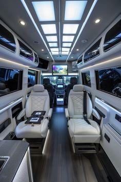 the interior of a bus with white leather seats