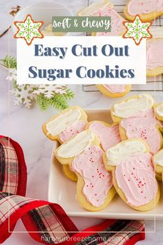 easy cut out sugar cookies with pink frosting on a white plate and red ribbon