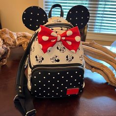 Minnie Mouse Loungefly Mini Backpack. Faux Leather, With Minnie Mouse Faces With Different Expressions. White Polka Dot Red Bow, And Black Ears With White Polka Dots. Side Pockets On Both Sides Of Bag, And Zipper Pocket In The Front. We Bought This Bag To Give To Our Daughter As A Gift For Her Birthday. But Someone Else Bought Her One And Gave It To Her Before We Made It To Her Birthday. Bag Is New Without Tags. White Backpack For Disney Trips, Trendy Minnie Mouse Backpack For Travel, Trendy Minnie Mouse Travel Backpack, White Mickey Mouse Backpack For Travel, White Mickey Mouse Travel Backpack, Minnie Mouse Backpack For Daily Use, White Mickey Mouse Backpack For Disney Trips, White Mickey Mouse School Backpack, Casual White Minnie Mouse Bag