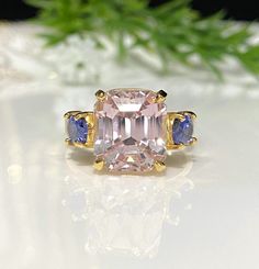 Vintage 14K Solid Yellow Gold Natural Kunzite & Tanzanite Ring....Marked 14K... Size 7 1/2...Total of weights 5.1grams...Measure of Kunzite 10.5 x 9.5MM 7.34ctw...and 2 oval cut Tanzanite 6 x 4MM .43ct x 2 = .86ct....Its in very good condition. Luxury Kunzite Wedding Ring, Luxury Kunzite Engagement Ring, Luxury Kunzite Ring Jewelry, Yellow Gold Tanzanite Ring With Polished Finish, Luxury Kunzite Ring, Tanzanite Ring, Rings Statement, Statement Rings, Favorite Jewelry