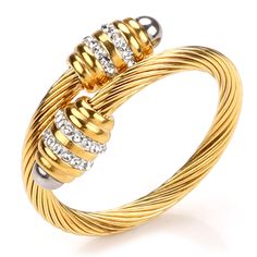 PRICES MAY VARY. Vintage and elegant twisted wire loop design, simple yet chic gold and silver plated rings with a unique interweaving vintage style that will never go out of style. Suitable for everyday use. The ring is flexible and adjustable, you can adjust its inner diameter freely, you don't need to worry about not fitting your finger. The ring is highly polished with a refined finish for a comfortable fit. PREMIUM MATERIAL: This vintage ring is made of 316L stainless steel cable loop, whic Gold Wire Wrapped Promise Ring, Modern Twist Metal Rings As Gift, Modern Twist Gold Stackable Rings As Gift, Gold Twisted Promise Ring, Gold Stackable Rings As Gift With Modern Twist, Twisted Gold Anniversary Rings, Elegant Gold Stainless Steel Stackable Rings, Modern Twist Yellow Gold Jewelry With Cubic Zirconia, Twisted Gold Metal Jewelry