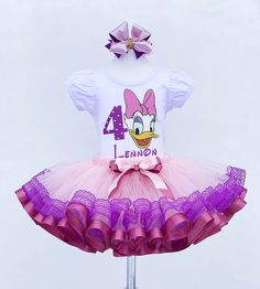 I offer you a beautiful birthday tutu outfit girl. NOTES FOR THE SELLER -Number for personalizing the top. -Name to personalize the vertex. -Need by date. Sleeve for the top - short, long. TOP. The top of it is 100% cotton. Size 3-24 months it is a bodysuit, 2T-10T it is a shirt. (Since it is more handmade always remember the shirt needs to be washed inside out, hand washed and air dried). SKIRT - made of soft tulle, edged at the bottom with a ribbon and decorated with a bow. Tutu is planted on Easter Birthday Ruffled Tutu Dress, White Sweet Tutu Dress For Birthday, Sweet White Tutu Dress For Birthday, Spring Princess Tutu Dress For Birthday, Princess Style Tutu Dress For Birthday In Spring, Fitted Tutu Dress For Easter Birthday, Fitted Tutu Dress For Birthday And Easter, Easter Birthday Fitted Tutu Dress, Fitted Ruffle Tutu Dress For Birthday