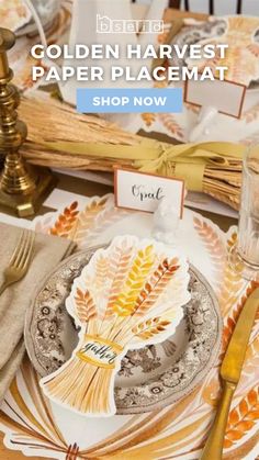 the golden harvest paper placemat is displayed on a table with goldware and napkins