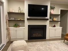 a living room filled with furniture and a flat screen tv mounted on the wall above a fireplace