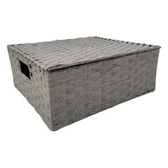 a large gray basket sitting on top of a white floor