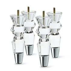 six clear glass vases with gold screws on them