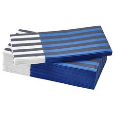 blue and grey striped napkins stacked on top of each other