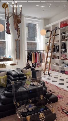 a living room filled with lots of furniture next to a window covered in light bulbs