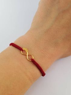 Lovely Gold plated Infinity flowers bracelet for women. Perfect anniversary present for wife. Sister Infinity present idea. Charm Infinity red string bracelet. Hand knitted protection red thread. Love you day gift. Handcrafted with gold plated over sterling silver 925 Infinity element and high quality hand knitted red thread Griffin. This pretty bracelet is 100% woterproff. Universal Adjustable size. Ready to ship in 1-3 business days. Visit our shop here https://etsy.me/2YxPw10 Visit our Facebo Macrame Bracelet Jewelry As Gift, Macrame Bracelet Jewelry Gift, Elegant Macrame Bracelets As Gift, Elegant Adjustable Friendship Bracelets As Gift, Elegant Adjustable Cord Friendship Bracelets As Gifts, Red Macrame Jewelry As Gift, Red Macrame Jewelry Gift, Braided Friendship Bracelets For Valentine's Day, Handmade Infinity Bracelet As Gift