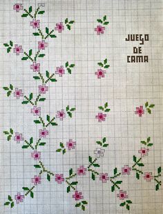 a cross stitch pattern with pink flowers and green leaves on white paper, which reads jesu de cama