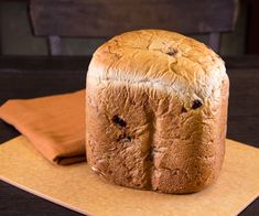 a loaf of bread sitting on top of a cutting board