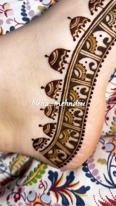 the foot is decorated with henna designs