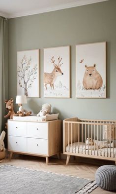 a baby's room with green walls and pictures on the wall