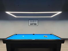 a pool table in an empty room with lights