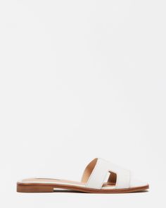 HADYN WHITE LEATHER Modern Footbed Sandals For Vacation In Spring, White Open Heel Slides For Summer, Modern Flat Mules For Vacation, Modern White Slide Mules, Modern White Beach Mules, Modern Flat Slides For Vacation, White Flat Mules With Leather Footbed, White Slide Mules For Spring, Summer Leather Flat Slides