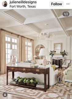 a living room filled with furniture and a chandelier