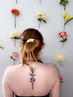 a woman with flowers behind her back