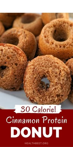 cinnamon protein donuts on a plate with text overlay that reads 30 calorie cinnamon protein donut