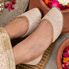 An all-year-round shoe! It's feminine, delicate and subtle. The multi-colour design leaves a lot of room for imagination in terms of styling. Slip these on with a butter-yellow Lucknowi saree or pair them with a blush-coloured kurta...you are sure to cut a dash regardless of how you style these! Outer material: Dupion Inner material: Genuine Leather Color: Blush Pink Type of work: Pearl and glass beads Care: Dry Clean only.If the shoe gets wet, remember to first dry in the sun before putting it back in the closet. Festive Mirror Work Slip-on Flats, Bollywood Style Festive Flats With Cutdana, Bollywood Style Festive Cutdana Flats, Bollywood Flats With Zari Work For Diwali, Bollywood Meenakari Flats For Festive Occasions, Bollywood Style Meenakari Flats For Festive Season, Bollywood Style Meenakari Flats For Diwali, Festive Meenakari Round Toe Flats, Bollywood Style Festive Flats With Round Toe