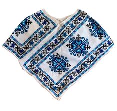 "Wool poncho handmade by the indigenous community of Mazahua. Stay warm in this closed poncho made of natural wool.  The Mazahua's are located in central Mexico and in the regional language of Nahuatl it means \"people of the deer\". Their embroidery is mainly of flowers in different colors." Traditional Handwoven Poncho One Size, Traditional Handwoven One-size Poncho, Artisan Handwoven Poncho, One Size, Traditional Handwoven Poncho, Traditional Blue Poncho, Traditional Blue One-size Poncho, Traditional One Size Woven Poncho, Handmade One-size Folk Poncho, Traditional Woven Shawl Poncho