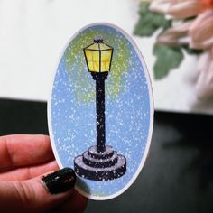 A beautiful lamp post glowing in the falling snow. Water-resistant vinyl sticker. Snow Water, Clary And Jace, Falling Snow, Beautiful Lamp, Narnia, The Snow, Gift Registry, Lamp Post, Sticker Paper