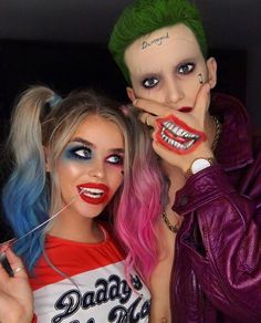 two people with makeup and hair are posing for the camera