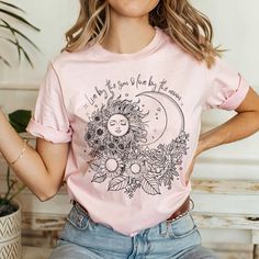 Hippie T-shirt for women, Celestial shirt, Astronomy Shirt, Floral shirt with sun and moon We use Bella Canvas shirts and recommend following our size chart for accuracy. The shirts are unisex and fit true to size. This shirt is NOT an oversized shirt. If you are looking for an oversized look, please consider sizing up 1-2 sizes. The model in the picture is wearing size 2XL. The shirts are comfortable and of light fabric. Great for any occasion and season. CARE INSTRUCTIONS Machine wash in warm Trendy Spring Tops With Moon Print, Summer Graphic Tee With Moon Print, Summer Moon Print Graphic Tee, Spring Graphic Tee With Moon Print, Casual Summer T-shirt With Sun And Moon Design, Spring Moon Print Graphic Tee, Spring Moon Print Relaxed T-shirt, Spring Moon Print Cotton T-shirt, Spring Moon Print Relaxed Fit T-shirt