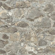 a stone wall is shown in grey and brown tones, with small rocks on it