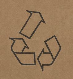 a cardboard box with a recycle symbol drawn on the bottom and an arrow in the middle