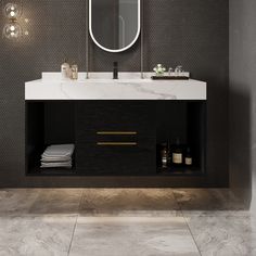 a bathroom with a sink, mirror and lights on the wall above it's counter