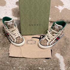 These Traditional Green, Red, And Brown Gucci Sneakers With The Gucci Logo Double G’s Embellished Over The Entire Shoe Is An Eye Catcher And A Must Have! Size: 38+G Designer High-top Lace-up Sneakers With Embroidered Logo, Designer Lace-up High-top Sneakers With Embroidered Logo, Luxury High-top Sneakers With Embroidered Logo, Designer High-top Sneakers With Embroidered Logo, Gucci Leather High-top Sneakers With Embroidered Logo, Gucci Designer High-top Sneakers With Embroidered Logo, Designer Gucci High-top Sneakers With Embroidered Logo, Gucci High-top Sneakers With Embroidered Logo, Gucci High-top Sneakers With Branded Heel And Round Toe