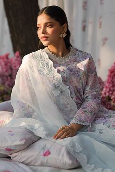 Brand: Cross StitchProduct Code: 0124RTSPRTLWN0224Collection: Cross Stitch Eid Lawn Unstitched Spring Summer CollectionFabric: Lawn DESIGN DETAILS: SHIRT Printed shirt (Lawn) 1 embroidered neckline 80" embroidered patti for shirt TROUSER Cambric dyed trouser DUPATTA Organza applique embroidered dupatta 2 appliques embroidered dupatta pallu ATTRIBUTE Effortlessly stylish and comfortable, the TENDER BREEZE 3-piece lawn suit exudes elegance with its stunning embroidered neckline and detailed patti for the shirt. The cambric dyed trouser and organza applique embroidered dupatta adds a touch of sophistication, while the two appliques embroidered dupatta pallu complete the ensemble. Unstitch for a customizable fit. DISCLAIMER:* Lining, Laces, and Tassels are not included in unstitched variants.* Silk Sets With Chikankari Embroidery, Eid Floral Embroidery Organza Palazzo Set, Designer Unstitched Suit With Sheer Dupatta, Designer Wear Unstitched Suit With Sheer Dupatta, Eid Floral Embroidered Organza Palazzo Set, Eid Floral Embroidered Dupatta, Designer Floral Embroidered Unstitched Suit, Floral Embroidered Lawn Suit For Wedding, Organza Applique