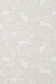 a white wallpaper with deers and flowers on it