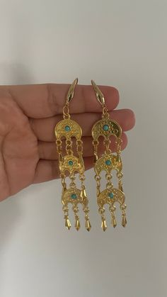 traditional sar parcham charm earrings approx 4 inches long  the sar parcham charm is a moon shaped charm with a blue stone. typically worn in jewelry in many Kurdish areas. Traditional Dangle Chandelier Earrings, Blue Metal Earrings With Latkans, Blue Dangle Chandelier Earrings With Latkans, Blue Chandelier Dangle Earrings With Latkans, Blue Latkans Chandelier Dangle Earrings, Bohemian Half Moon Metal Earrings, Elegant Crescent Earrings For Festival, Elegant Blue Earrings With Moon Charm, Elegant Crescent Shaped Festival Earrings